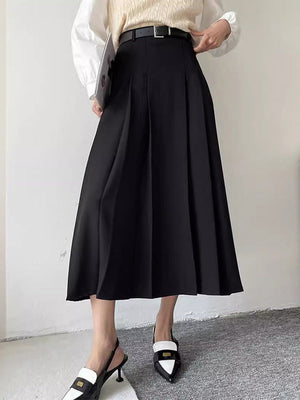 Jupe plissée coupe trapèze, taille haute, à empiècements, couleur unie