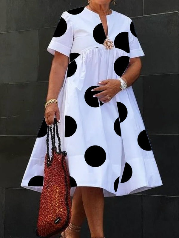 Robe mi-longue plissée imprimée coupe trapèze, à manches courtes, à pois, à empiècements, à col rond