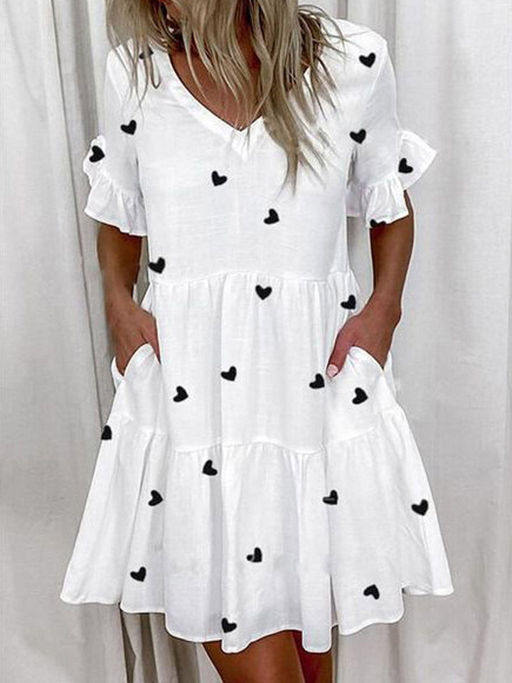 Robe mi-longue plissée imprimée coupe trapèze, taille haute, à poches, à empiècements, à col en V, couleur contrastée
