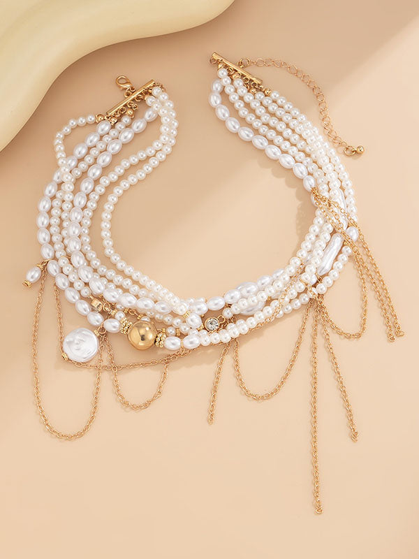 Collier géométrique superposé à pompons