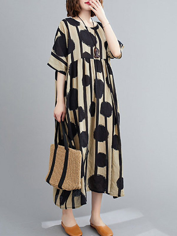Robe mi-longue à pois, à empiècements, à col rond