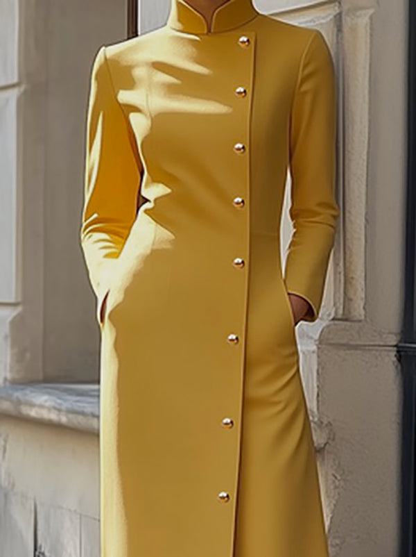 Robe longue ample boutonnée à manches longues, à poches, à empiècements, à col montant, couleur unie