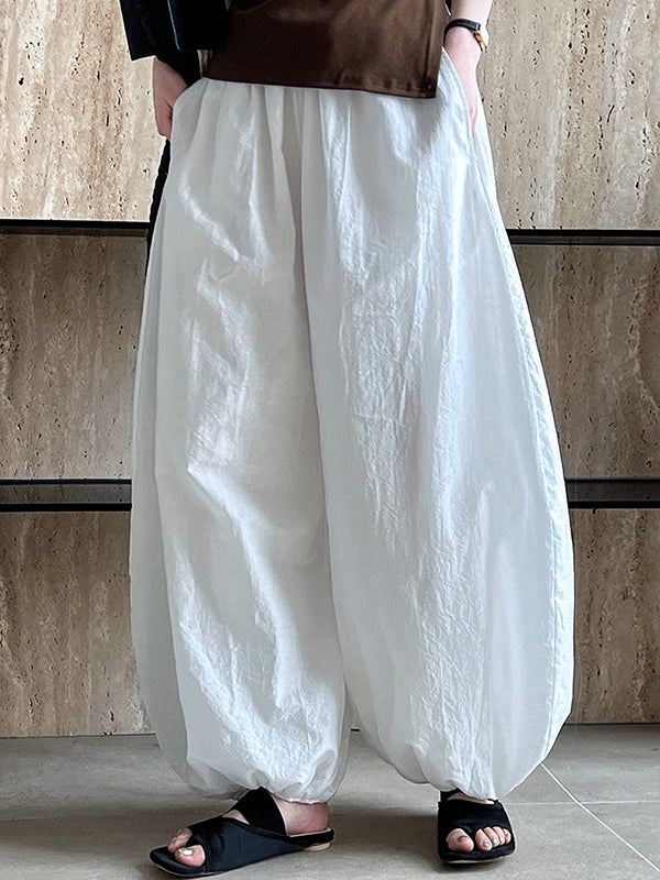 Pantalon taille haute, à taille élastique, à empiècements, couleur unie