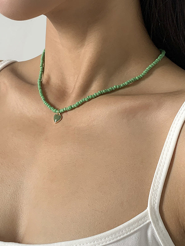Collier à perles, couleur unie