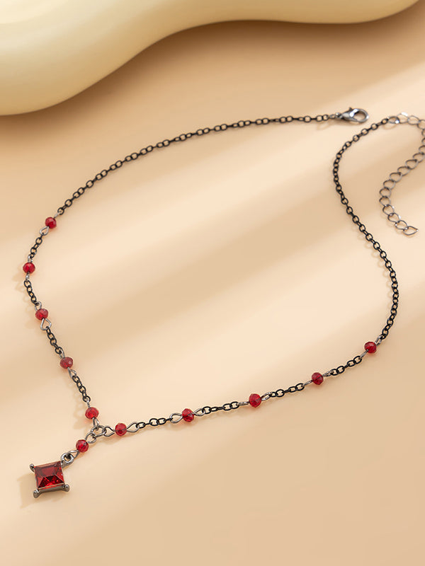 Collier géométrique à pompons
