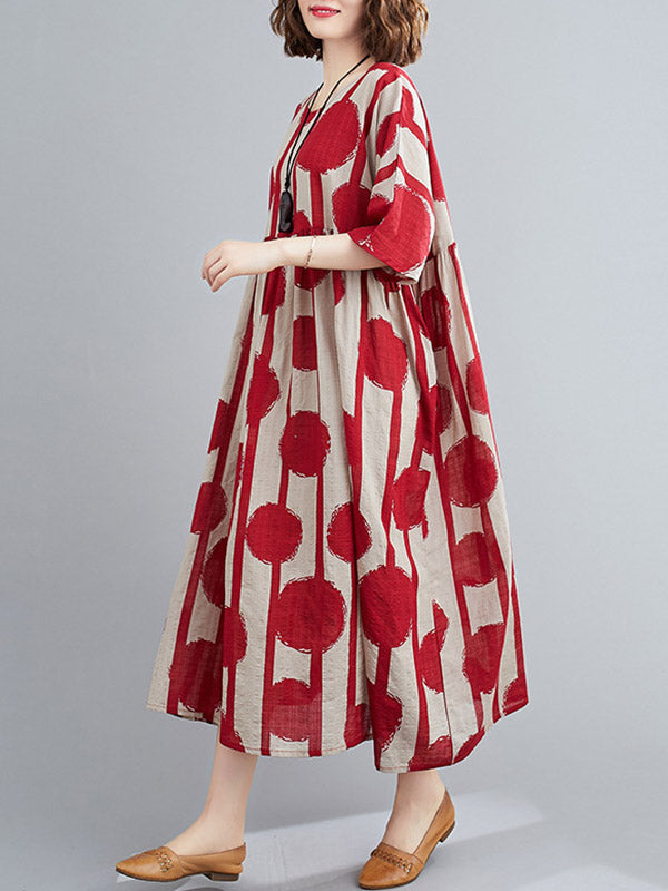 Robe mi-longue à pois, à empiècements, à col rond