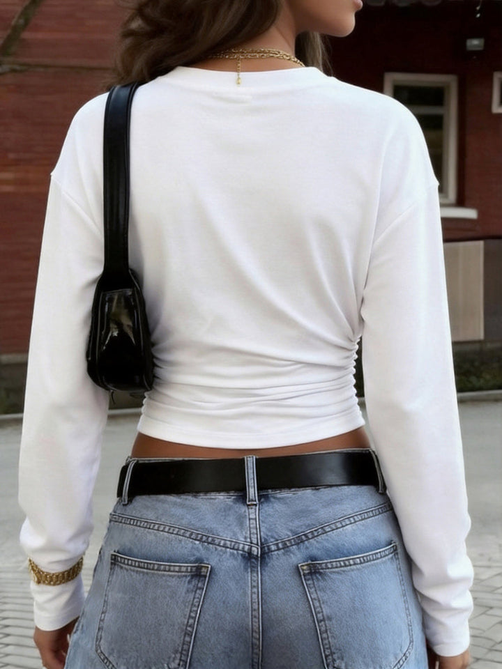 T-shirt plissé ample à taille élastique, à manches longues, à col rond, couleur unie