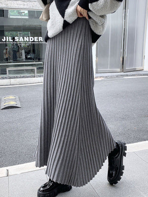 Jupe plissée coupe trapèze, taille haute, couleur unie