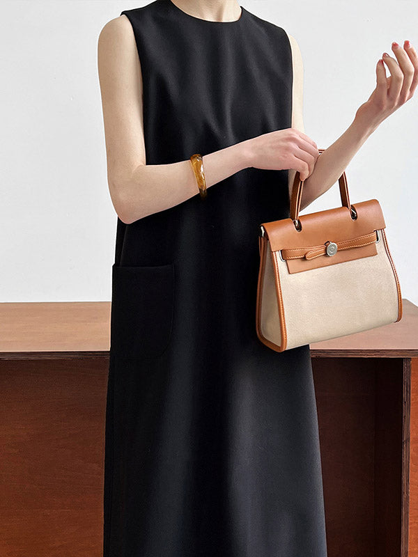 Robe mi-longue ample fendue dans le dos taille haute, à poches, à fermeture éclair, à col rond, couleur unie