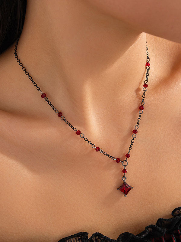Collier géométrique à pompons