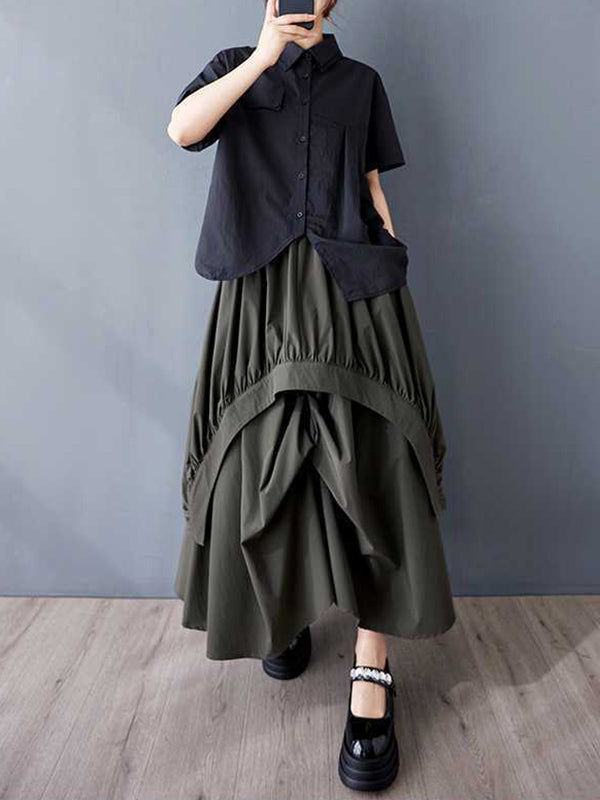 Jupe ample asymétrique plissée coupe trapèze, à taille élastique, à poches, couleur unie