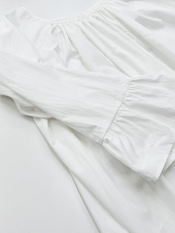 Robe longue ample plissée à manches évasées, à empiècements, à col rond, couleur unie