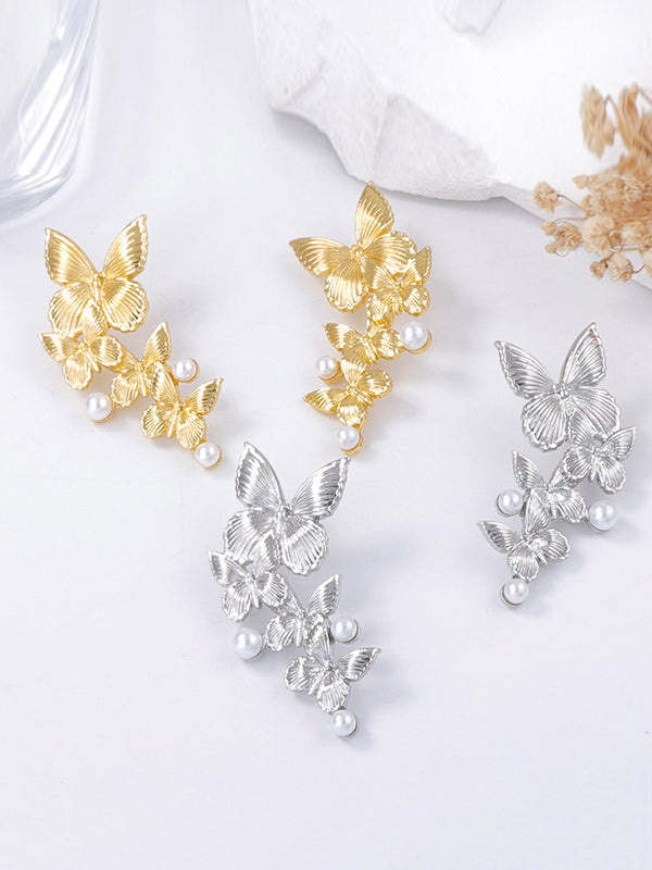 Boucles d'oreilles brillantes en forme de papillon