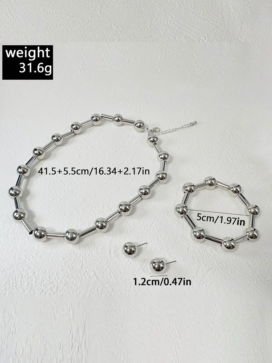 Parure collier et boucles d'oreilles géométrique couleur unie