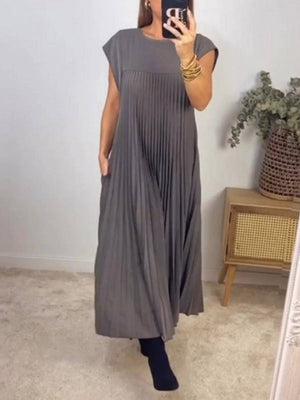 Robe longue plissée coupe trapèze, taille haute, à poches, à empiècements, à col rond, couleur unie