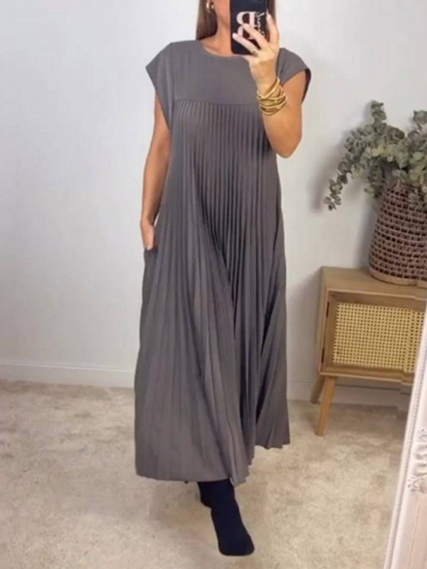 Robe longue plissée coupe trapèze, taille haute, à poches, à empiècements, à col rond, couleur unie