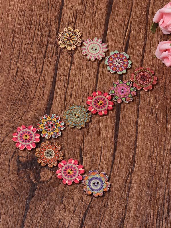 Environ 100 boutons multicolores à motif floral.