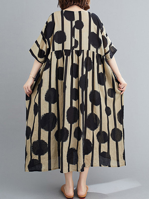 Robe mi-longue à pois, à empiècements, à col rond