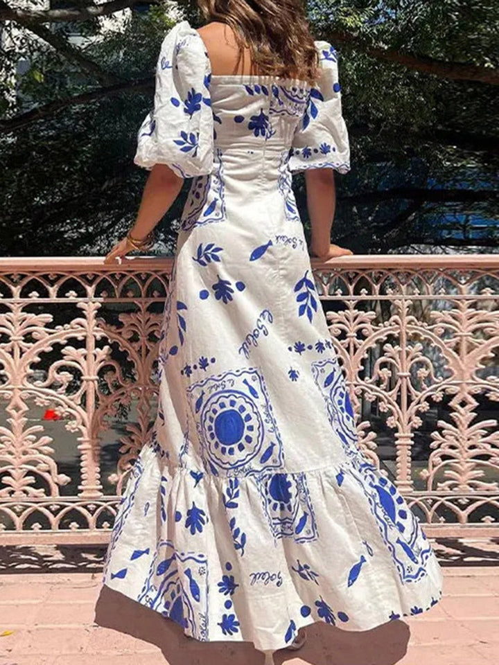 Robe mi-longue plissée imprimée volantée coupe trapèze, taille haute, à empiècements, à col carré, couleur contrastée