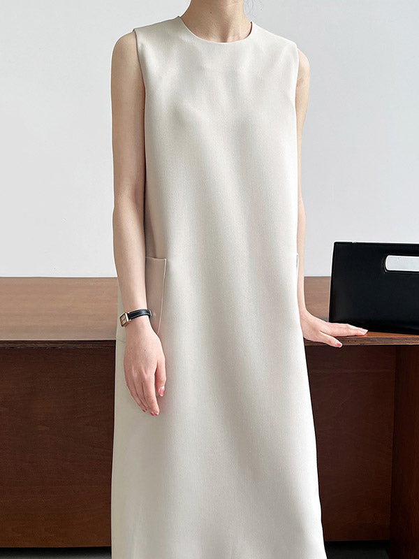 Robe mi-longue ample fendue dans le dos taille haute, à poches, à fermeture éclair, à col rond, couleur unie