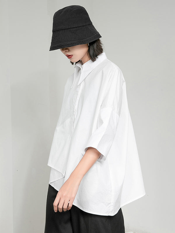 Blouse unie à coupe irrégulière et col revers