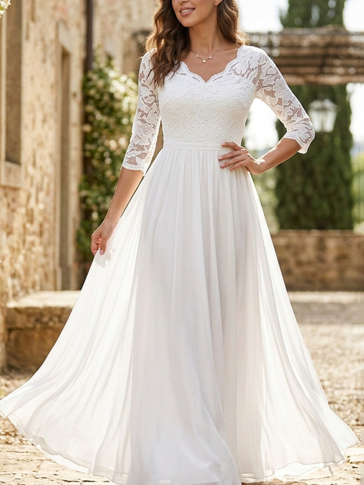 Robe longue plissée transparente coupe trapèze, taille haute, à empiècements, à col en V, couleur unie