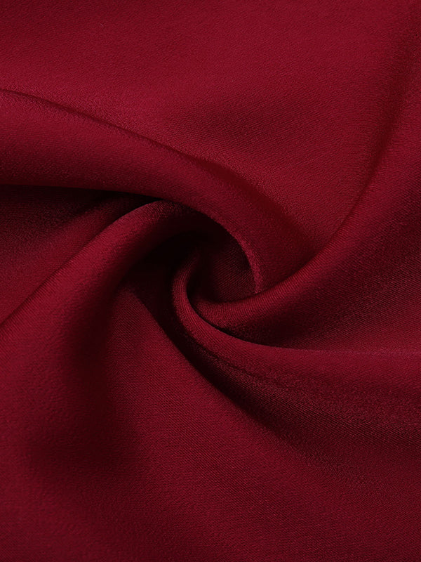 Chemisier ample plissé à manches bouffantes, à empiècements, à col montant, couleur unie