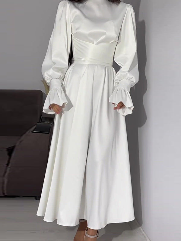Robe longue plissée coupe trapèze, à manches longues, à taille nouée, à fermeture éclair, à col cheminée, couleur unie