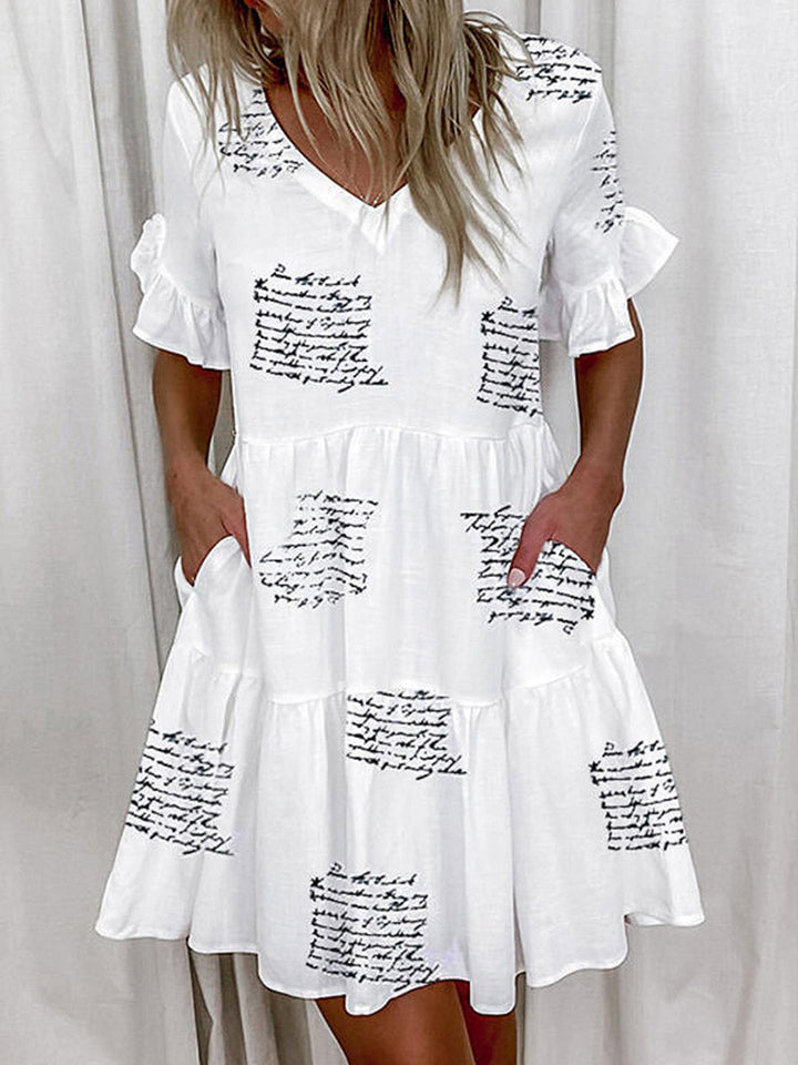 Robe mi-longue plissée imprimée coupe trapèze, taille haute, à poches, à empiècements, à col en V, couleur contrastée