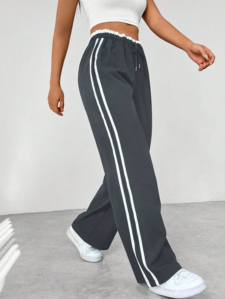 Pantalon en tissu ajustable à jambes larges pour femmes