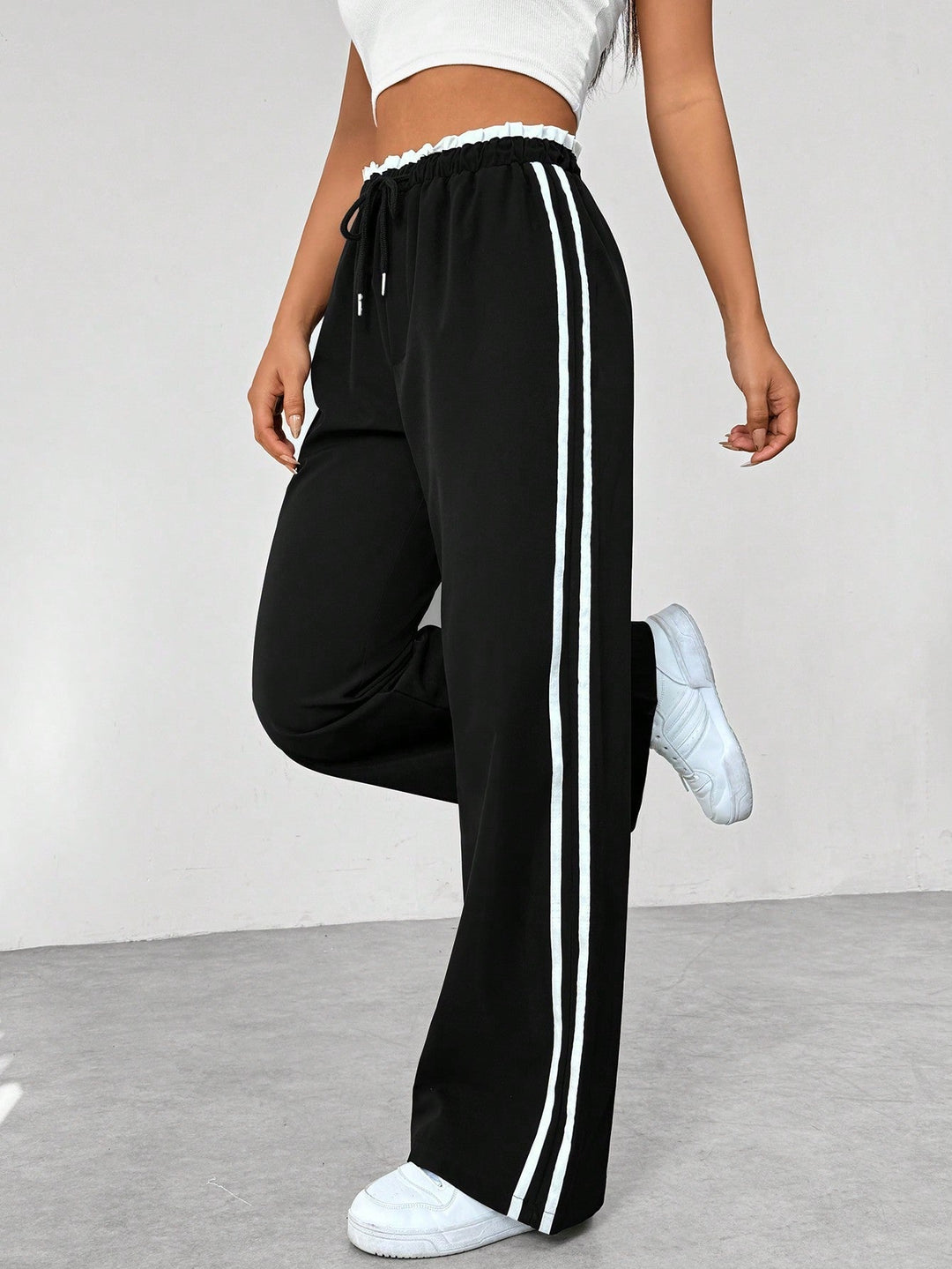 Pantalon en tissu ajustable à jambes larges pour femmes