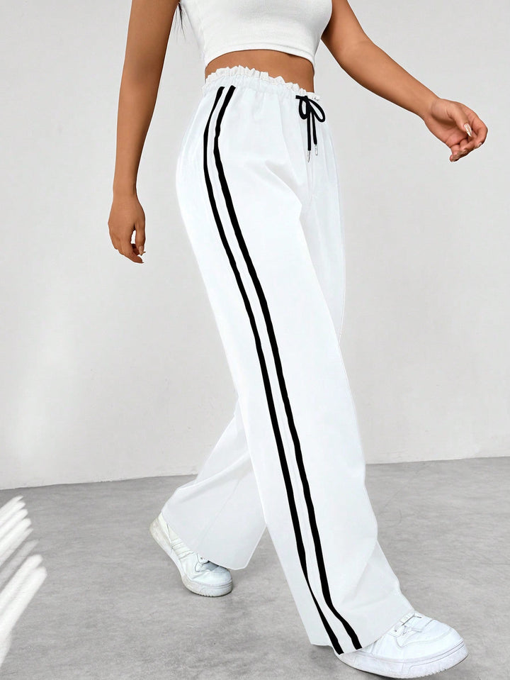 Pantalon en tissu ajustable à jambes larges pour femmes