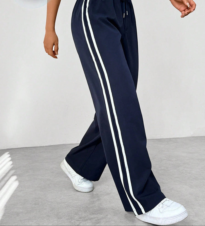 Pantalon en tissu ajustable à jambes larges pour femmes