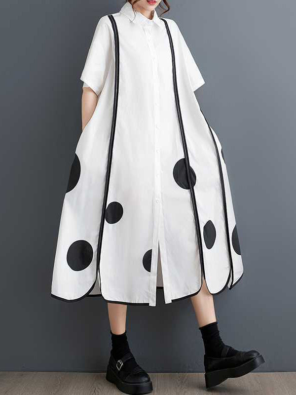 Robe chemise boutonnée fendue devant coupe trapèze, à manches mi-longues, à poches, à pois, à empiècements, à col revers