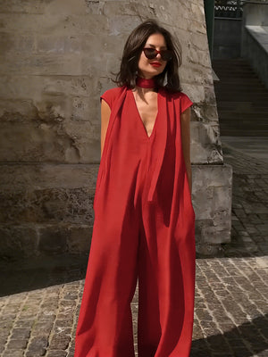 Combinaison ample à jambes larges, à poches, à rubans, à décolleté en V profond, couleur unie