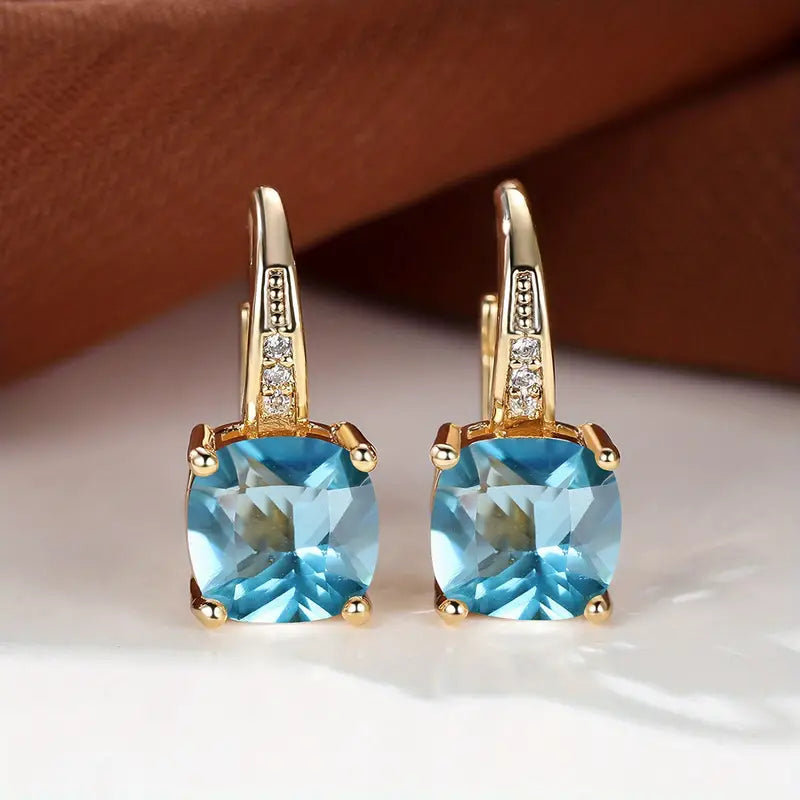 Boucles d'oreilles dorées avec cercle de pierre mystique