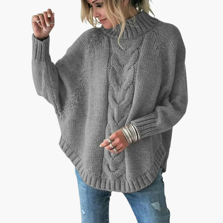 Pull femme avec col roulé et motif en torsades