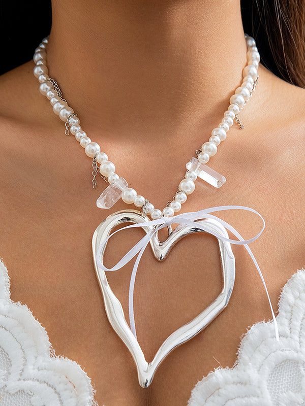 Collier perlé délicat en forme de cœur