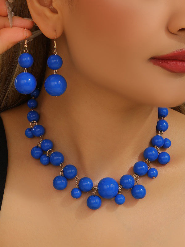 Parure collier et boucles d'oreilles à empiècements