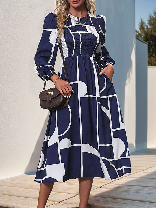 Robe mi-longue imprimée coupe trapèze, taille haute, à taille élastique, à empiècements, à col rond