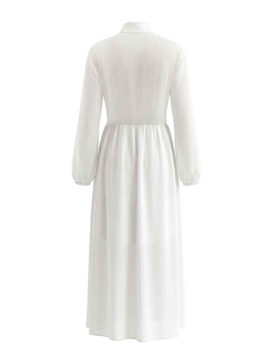 Robe chemise boutonnée plissée coupe trapèze, à poches, à empiècements, à col montant, couleur unie