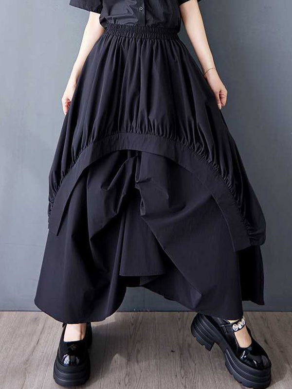 Jupe ample asymétrique plissée coupe trapèze, à taille élastique, à poches, couleur unie