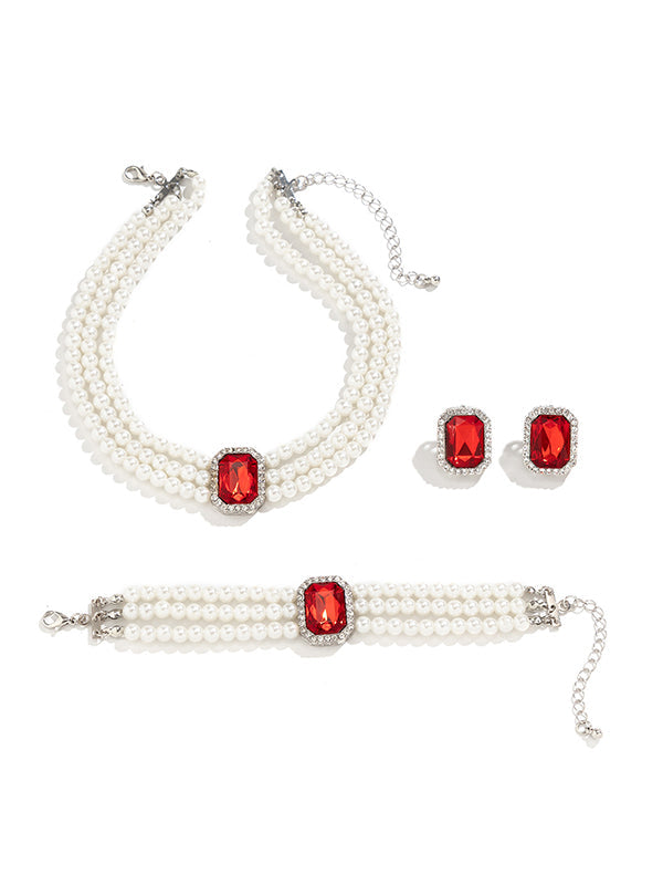 Parure bracelet, collier et boucles d'oreilles géométrique superposée à strass