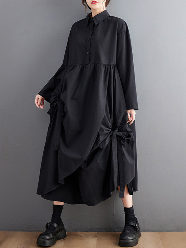 Robe chemise boutonnée plissée nouée coupe trapèze, à manches longues, à poches, à col revers, couleur unie