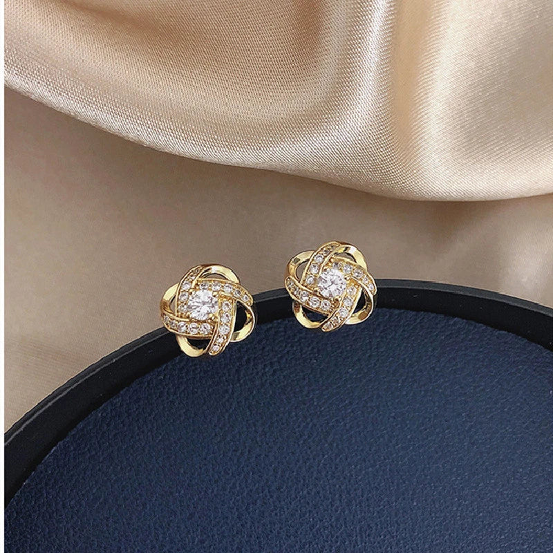 Boucles d'oreilles en croix spirale de fleurs