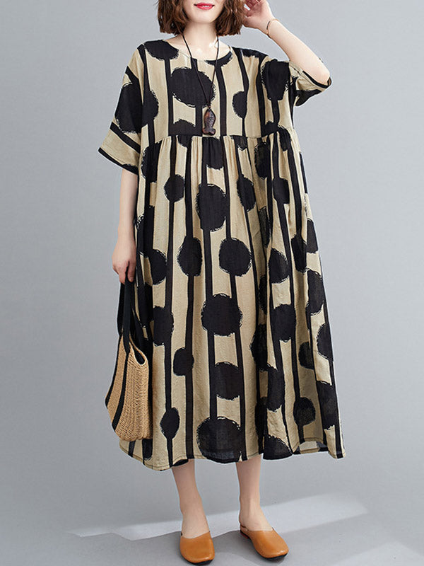 Robe mi-longue à pois, à empiècements, à col rond