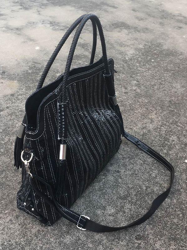 Sac en cuir à bandoulière rayé à empiècements
