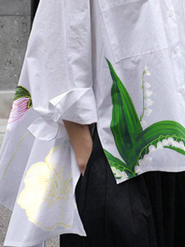 Chemisier ample asymétrique fendu sur le côté à ourlet plongeant, à imprimé floral, à empiècements, à col revers