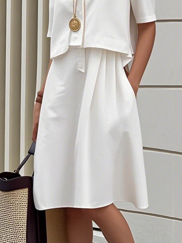Robe chemise mi-longue boutonnée effet deux pièces, à manches mi-longues, à col revers, couleur unie