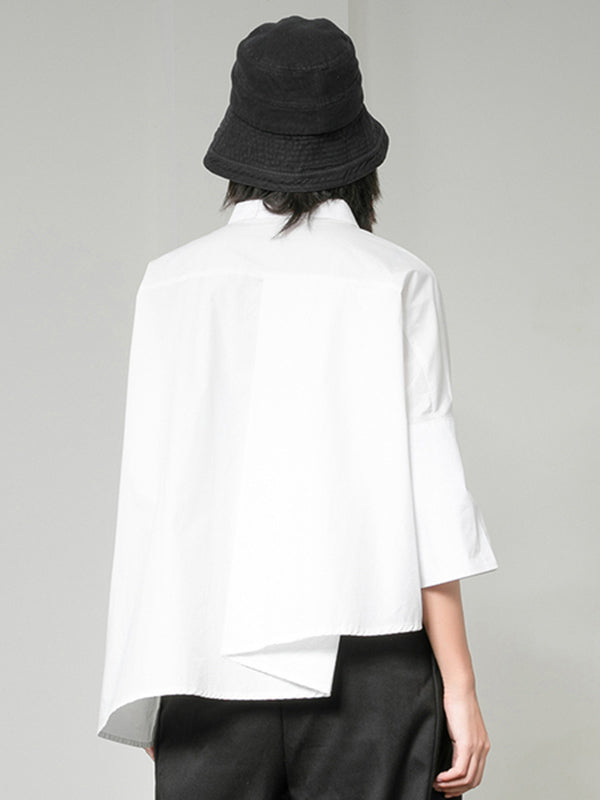 Blouse unie à coupe irrégulière et col revers